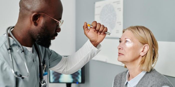 Doctor20performs20eye20exam-sacuUM-rss