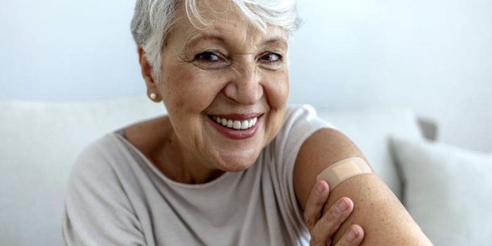 Woman20smiling20after20getting20vaccinated-6sG2wt-rss